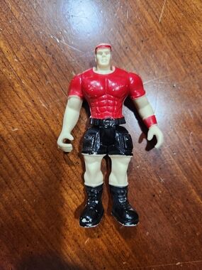 Vintage Red and Black Action Figure Toy - Muscular Male Figure